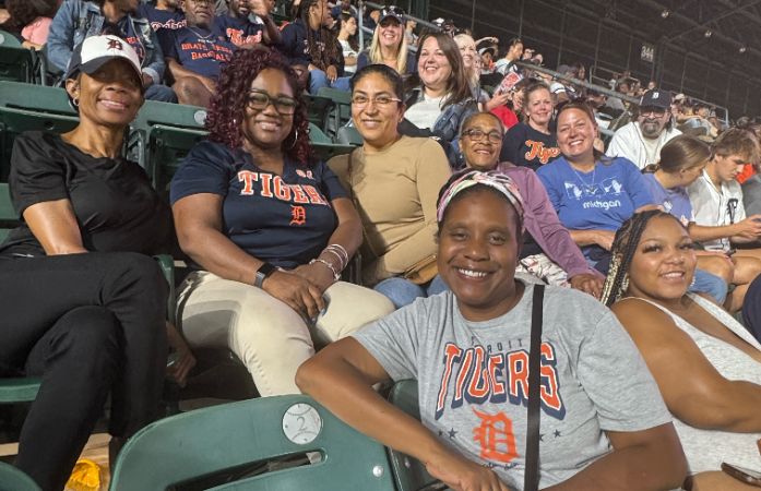  Staff sitting in stadium seats
